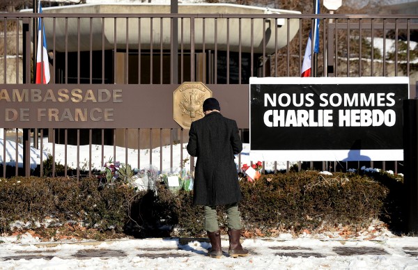 On January 8, 2015, "We are Charlie Hebdo" hung over the fence at the French Embassy. (Olivier Douliery/Abaca Press/TNS)