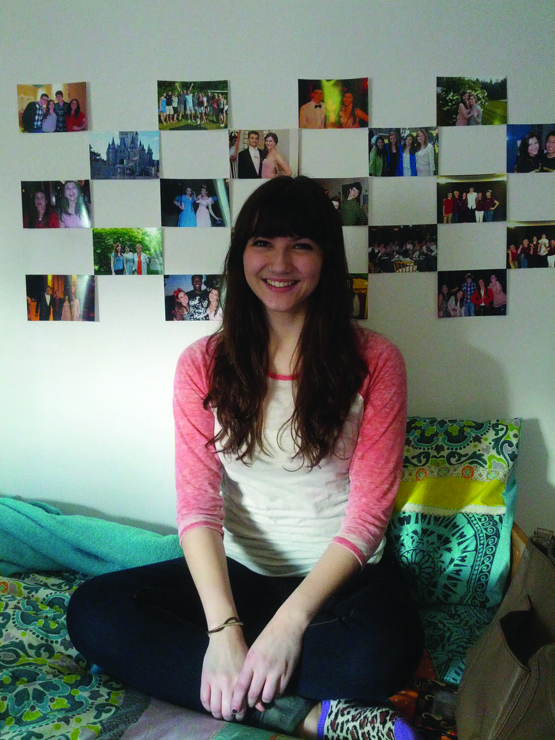 Alexandra Vittorini, FCLC ’15, smiles in her newly decorated dorm room. (Sherry Yuan/The Observer)