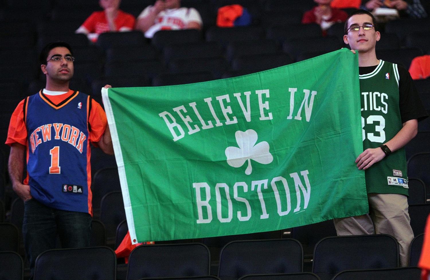 A New York Knicks and Boston Celtics fan hold up a sign on Saturday, April 20, 2013, to pay tribute to the victims of the Boston Marathon. The Boston Celtics faced the New York Knicks in the NBA's Eastern Conference playoffs in New York, New York. (Matt Stone/Boston Herald/MCT)