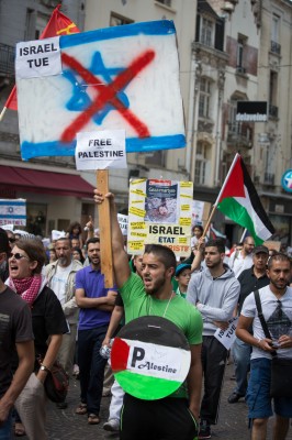 Palestinians march through the street protesting against Israel. Courtesy of Alex Proimos via Flickr