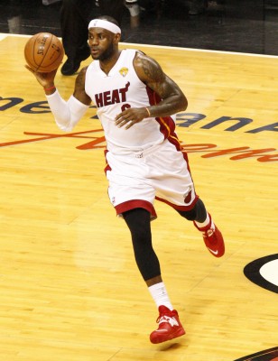 The Miami Heat's LeBron James passes the ball in the first quarter against the San Antonio Spurs in Game 4 of the NBA Finals at American Airlines Arena in Miami on Thursday, June 12, 2014. (Hector Gabino/El Nuevo Herald/MCT)