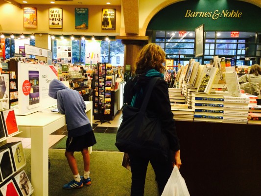 Barnes & Noble shoppers contemplate whether to buy their books in print or to invest in an e-reader. (Lauren Macdonald/The Observer)