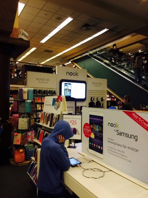 Barnes & Noble shoppers contemplate whether to buy their books in print or to invest in an e-reader. (Lauren Macdonald/The Observer)