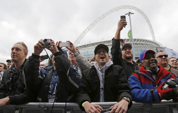Fans cheer as the Dallas Cowboys are introduced on stage during an NFL All Access fan event on Saturday, Nov. 8, 2014, at Wembley Stadium in London. (Rodger Mallison / Fort Worth Star-Telegram/MCT)