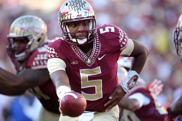 Florida State quarterback Jameis Winston (5) hands off during the second half against Florida at Doak Campbell Stadium in Tallahassee, Fla., on Saturday, Nov. 29, 2014. Florida State won, 24-19. (Joe Burbank / Orlando Sentinel/TNS)