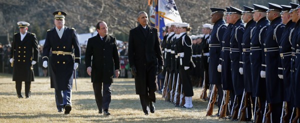 French President Francois Hollande and US President meet for a military review at the White House, in Washington, DC, on February 11, 2014. (Pool photo by Chip Somodevilla courtesy of Getty Images via Abaca Press/MCT)