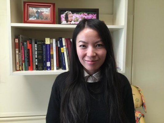 Professor Yiju Huang, Ph.D, poses for a photo in her office, 426-D in Lowenstein. Huang, along with three other professors, recently received tenure from Fordham University. (PHOTO BY LYDIA BENNER/ THE OBSERVER)