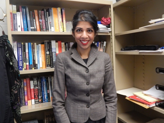 Professor Anjali Dayal poses for a photo in her office, 403-H in Lowenstein. Dayal, along with three other professors, recently received tenure from Fordham University. (PHOTO BY LYDIA BENNER/ THE OBSERVER)