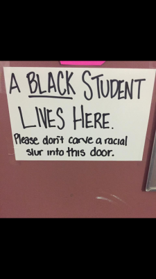 Berry's sign, which uses language different than other solidarity signs posted in response to the bias crimes (COURTESY OF PEYTON BERRY)