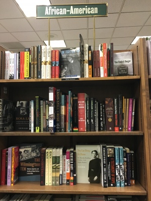 Books are stacked under the African American section of the bookstore. (PHOTO BY JESSICA HANLEY/ THE OBSERVER)