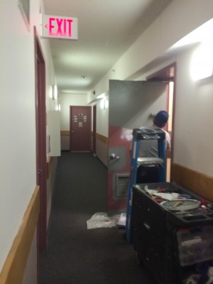 Around 2 p.m., the door of the garbage room on the 10th floor was being painted. (PHOTO BY CECILE NEIDIG/THE OBSERVER) 