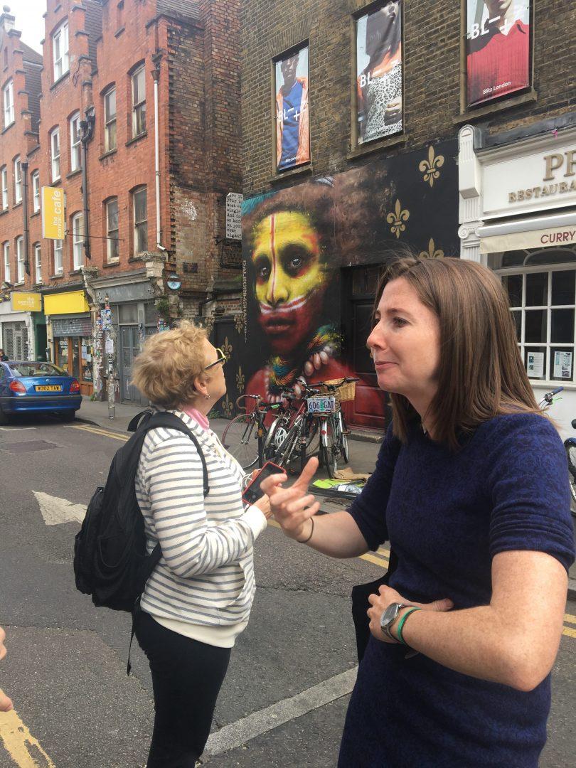 Professor Stone can be seen admiring some of the street art on the tour of Shoreditch. (DEIRDRE MCGRATH/ THE OBSERVER)